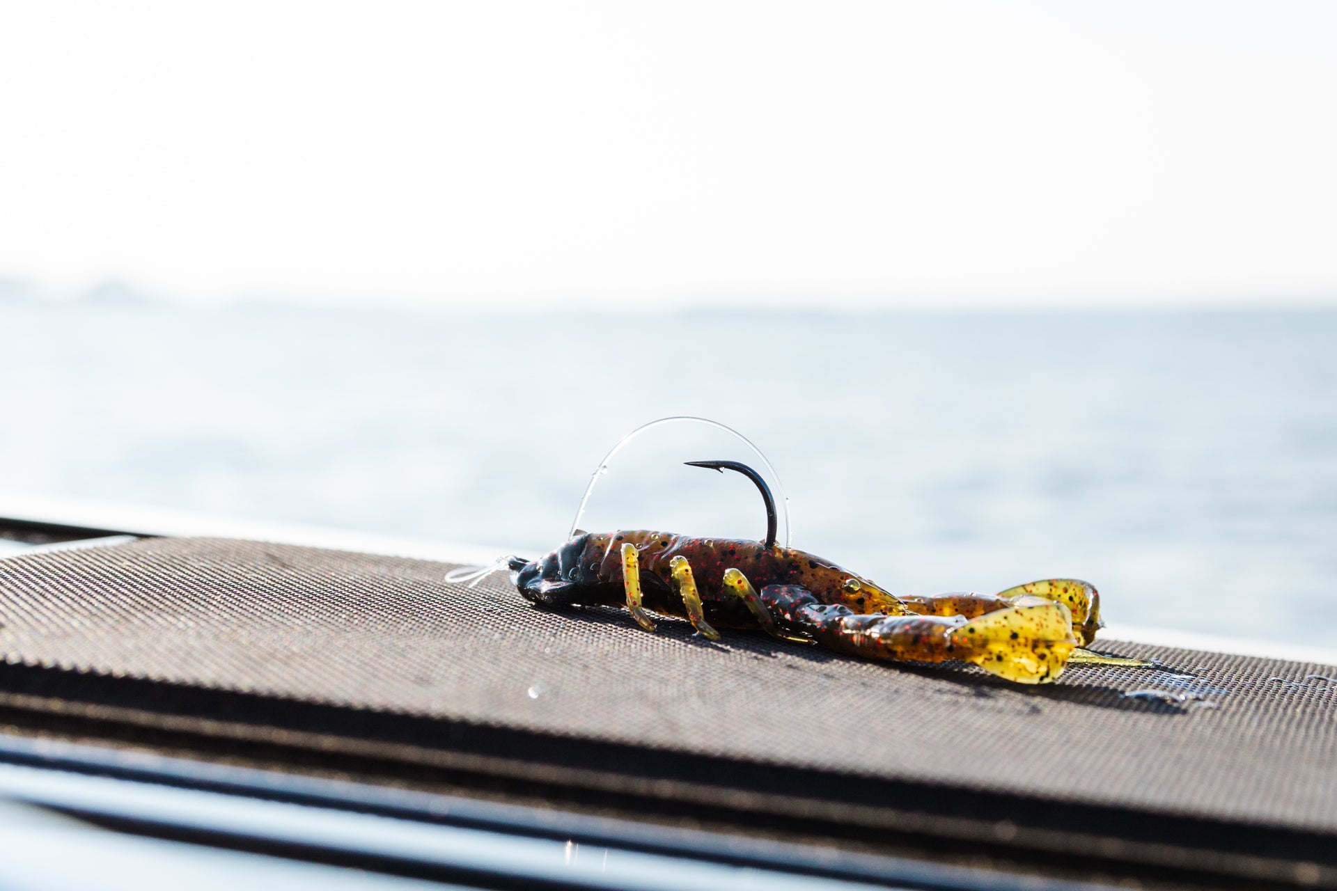 Berkley PowerBait® Clatter Craw bait posed on the deck of a boat